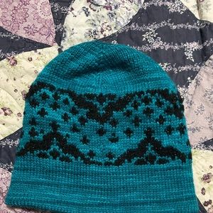 Hand knitted garments. Hats, sweaters, vests etc. I design and knit for you.